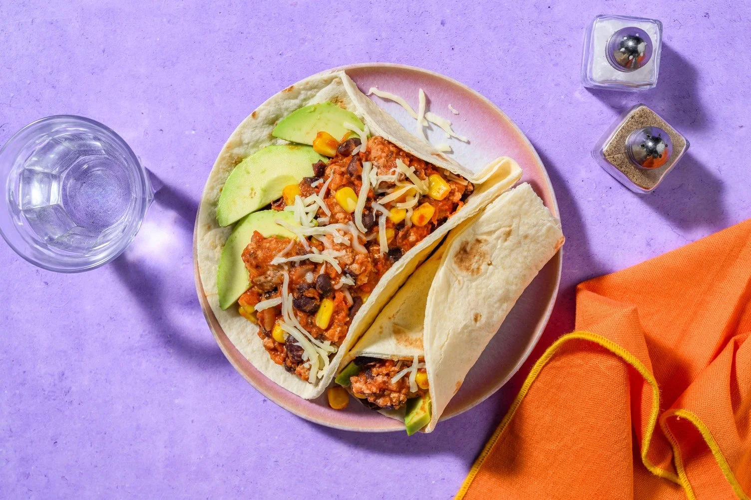 Burritos with pork, black beans, and avocado